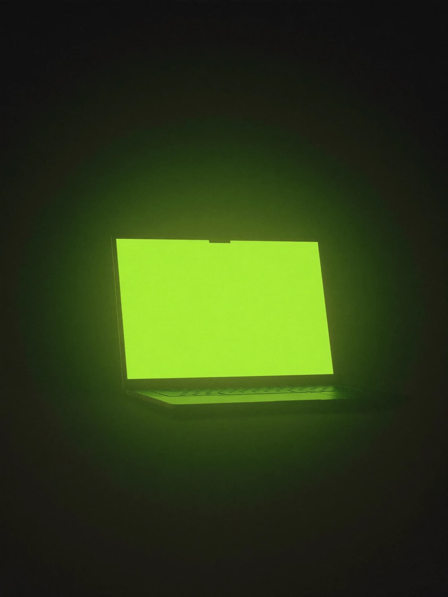 A laptop glowing in the dark, one senior team building at AI speed